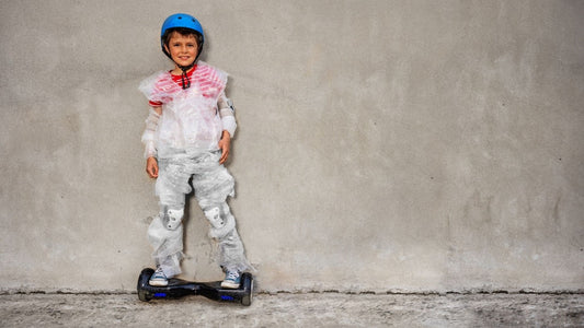 A kid standing on Rideo hoverboard