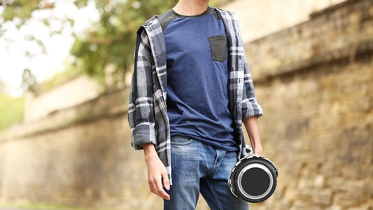 A person standing with his Rideo hoverboard