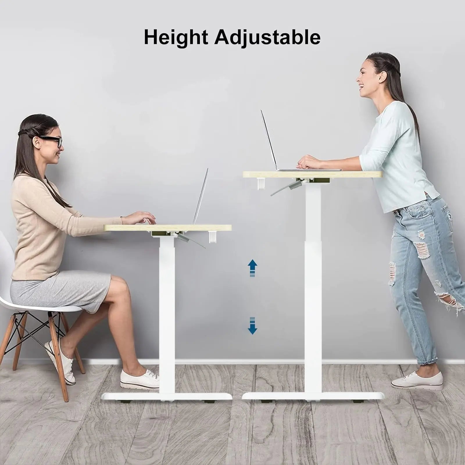 The desk is shown from a side view emphasizing the height adjustment feature, with two women, one seated and one standing, demonstrating the desk’s versatility in accommodating different working positions.