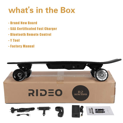 A content box image displaying all items included with the skateboard: board, charger, remote control, tools, and manual.